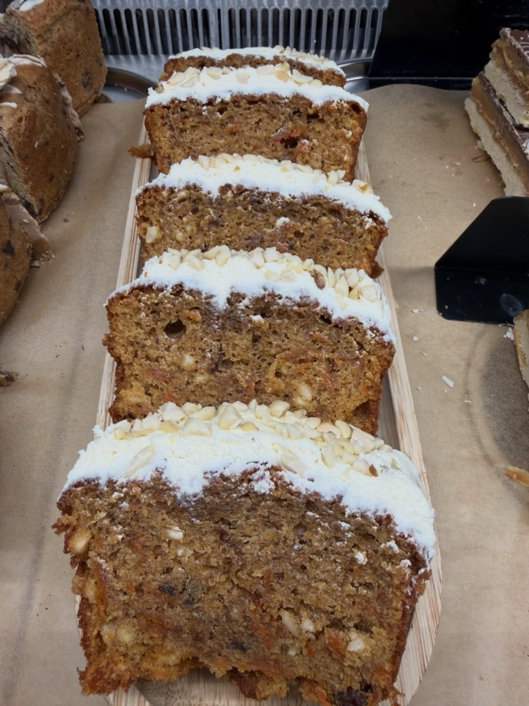 Sliced carrot cake traybake with cream cheese icing