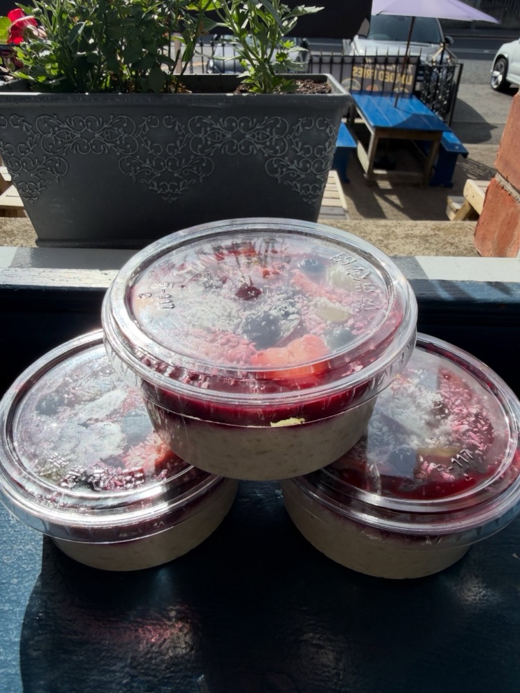 Overnight oats pots topped with mixed berries