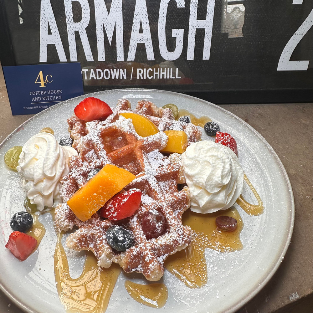Breakfast waffles with seasonal fruit and cream