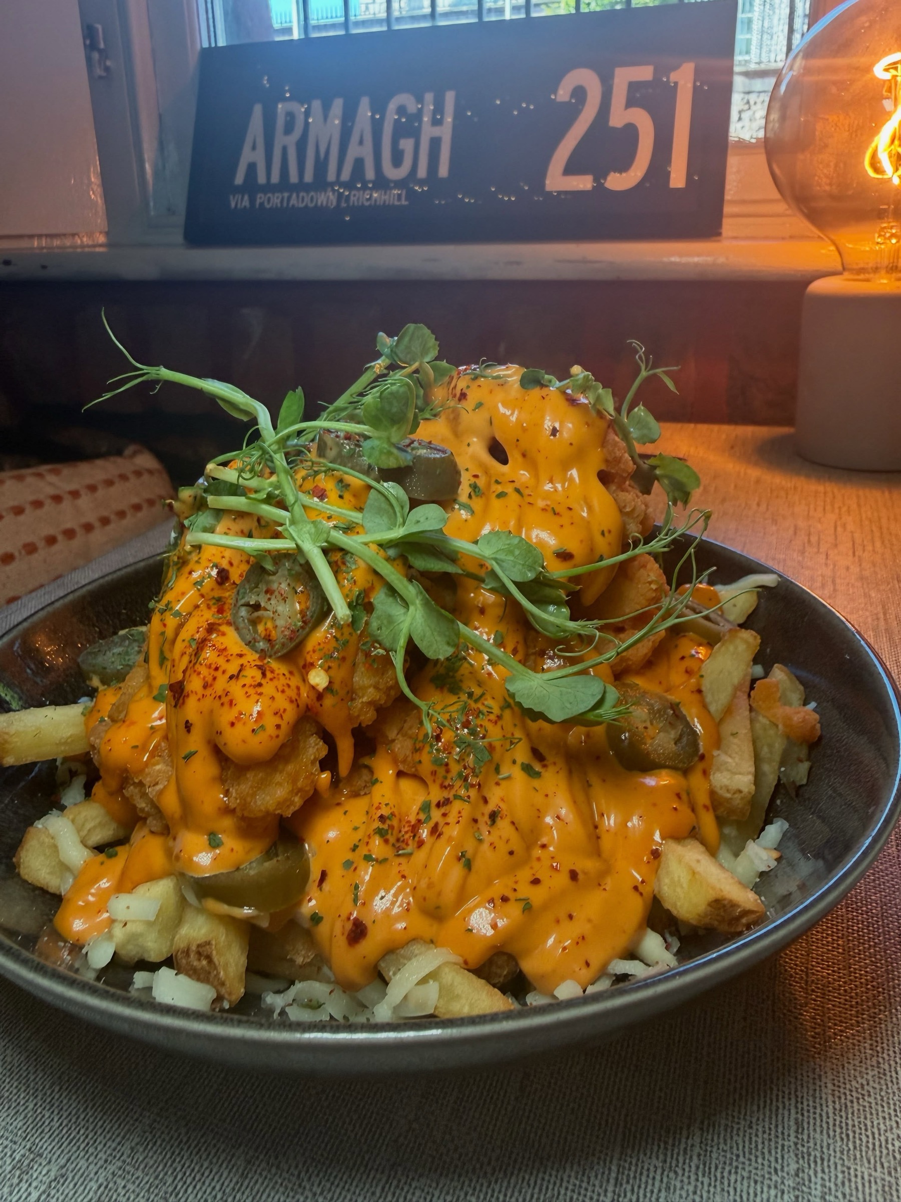 4C's loaded spicy fries, piled high with crispy chicken, melted cheese and jalapeños